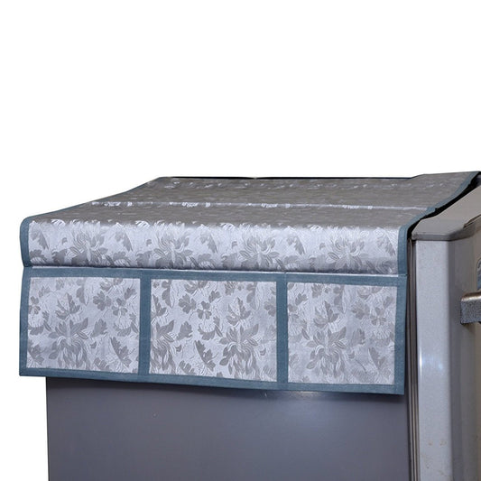 Decorative refrigerator top cover with assorted designs.